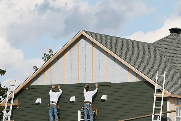 Professional Siding Installation technician working in South Boston, MA